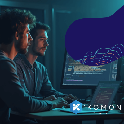 IT guys looking at a monitor where a code is on the screen.